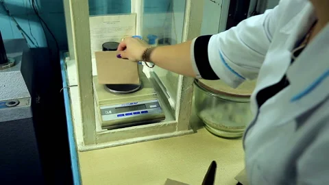 Paper mill checking product to the density of cardboard Stock Footage 91222399