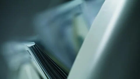 Paper money flows through high speed banking device machine during routine task Stock Footage 332366680