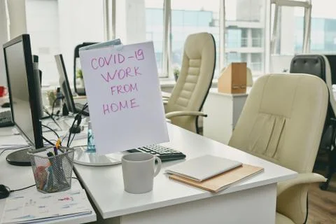 Paper with note about work from home because of covid19 epidemy on monitor Photos
