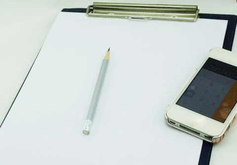 Paper note and calculator Stock Photos
