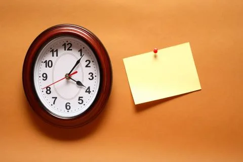 Paper note and clock Stock Photos