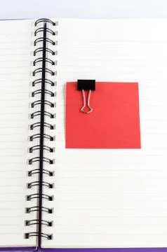 Paper note with clip on notebook Stock Photos