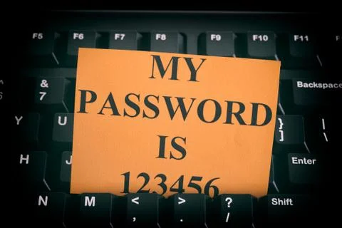 Paper note with easy password on black computer keyboard Stock Photos
