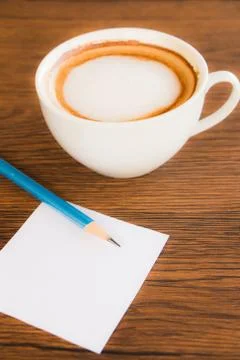 Paper note with pencil and coffee cup Stock Photos