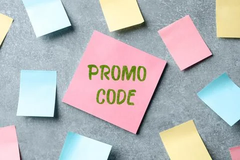 Paper note with words Promo Code on light grey table, flat lay Stock Photos