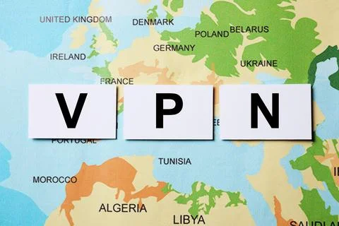 Paper notes with acronym VPN (Virtual Private Network) on world map, flat lay Stock Photos