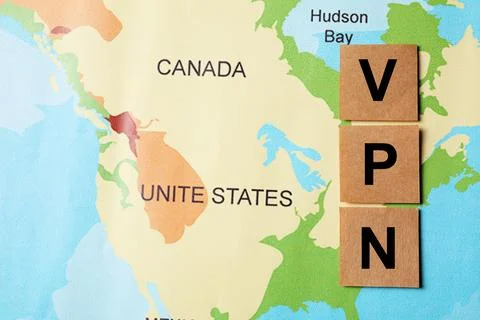 Paper notes with acronym VPN (Virtual Private Network) on world map, flat lay Stock Photos