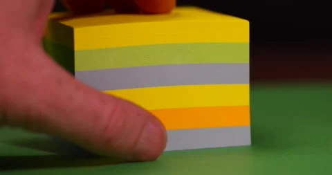 Paper for notes on green paper close up, stationery made of thin paper with glue Stock Footage 327833066