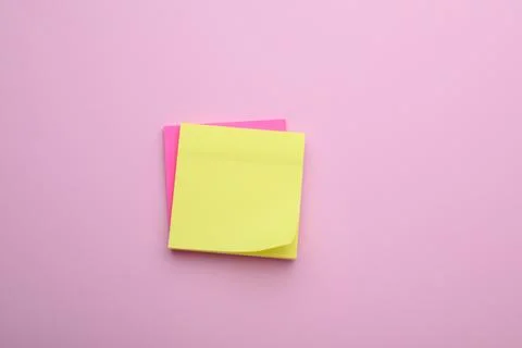 Paper notes on pale pink background, top view Stock Photos