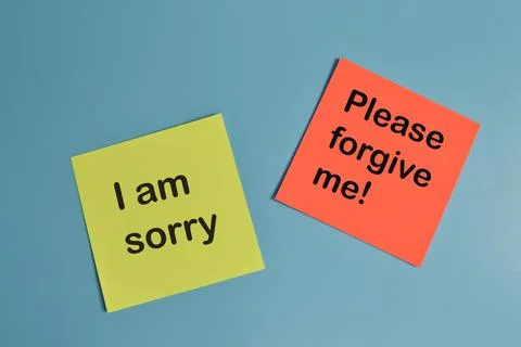Paper notes written with I AM SORRY and PLEASE FORGIVE ME! Stock Photos