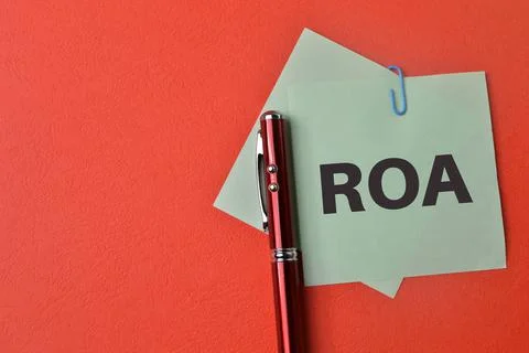 Paper notes written with ROA stands for Return On Assets Stock Photos