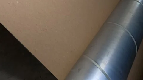 Paper passing on a metal roller Video stock 305856456