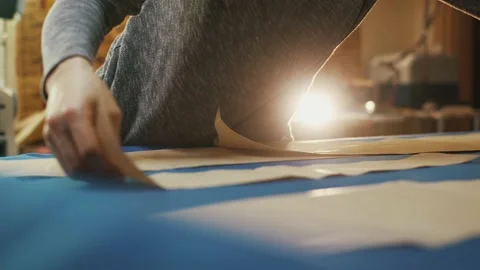 Paper pattern on the table. The dressmaker's work process. Video stock 152103948