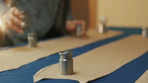 Paper pattern on the table. The dressmaker's work process. 스톡 동영상 152104028