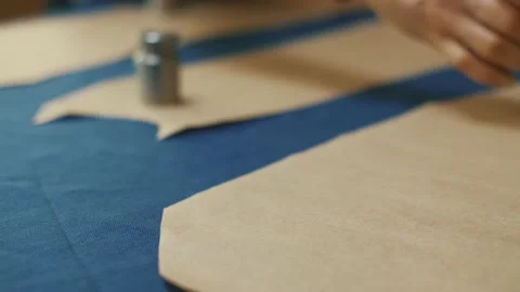 Paper pattern on the table. The dressmaker's work process. Stock Footage 152104042