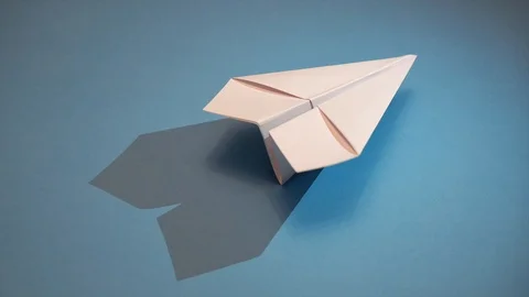 Paper plane on blue background with moving shadow 스톡 동영상 88929435