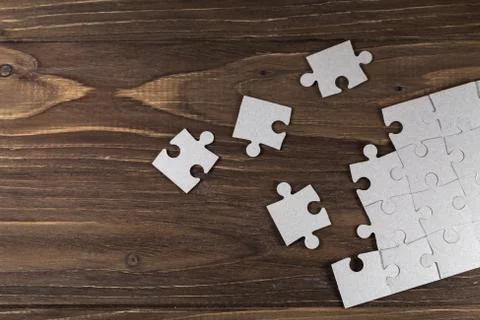 Paper puzzles on a floor Stock Photos