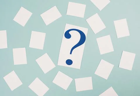Paper with a question mark in the middle, small  empty stickers around, copy Stock Photos