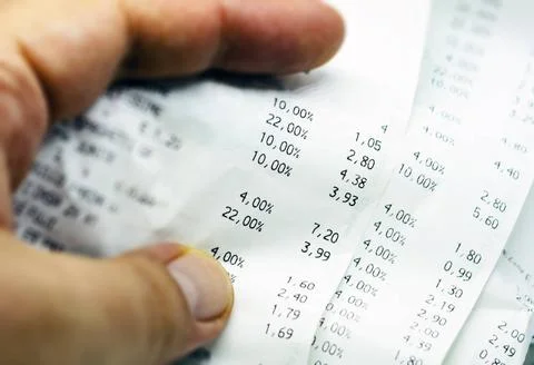 a paper receipt with the list of economic issues. Business and economics.... Stock Photos