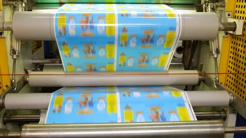 The paper ribbon is spinning on special rollers Stock Footage 129305970