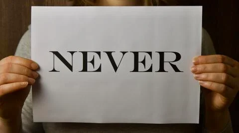 A paper that says " never " when making the necessary decision Stock Photos