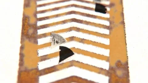 Paper scraps flying over an orange zigzag striped road Stock Footage 346778350