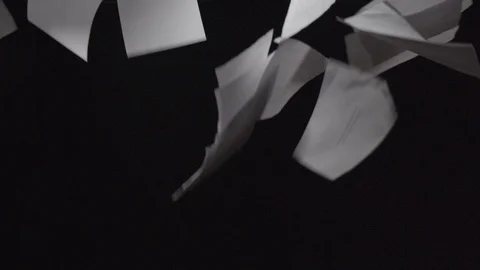 Paper sheet falling down on a black background - 200Fps slow motion Stock Footage 103543126