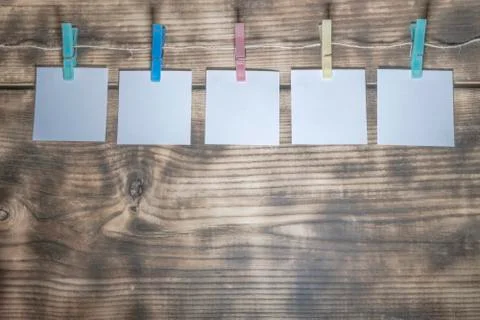 Paper sheets hung on a stitch Stock Photos