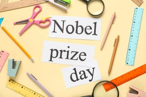 Paper sheets with text NOBEL PRIZE DAY and stationery on yellow background Stock Photos