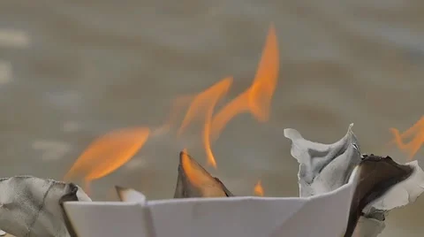 Paper Ship is Burning on Watery Surface Flame Dreams Did Not Come True Lost Stock Footage 64774375