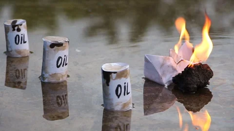 A paper ship with oil barrels explodes from their leakage Stock Footage 108632067