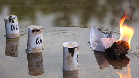A paper ship with oil barrels explodes from their leakage Stock Footage 108634718