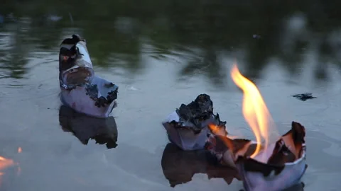 A paper ship with oil barrels explodes from their leakage Stock Footage 108979949