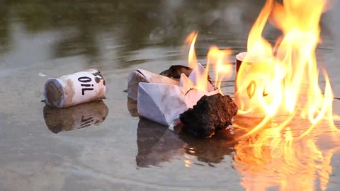 A paper ship with oil barrels explodes from their leakage Stock Footage 109091229