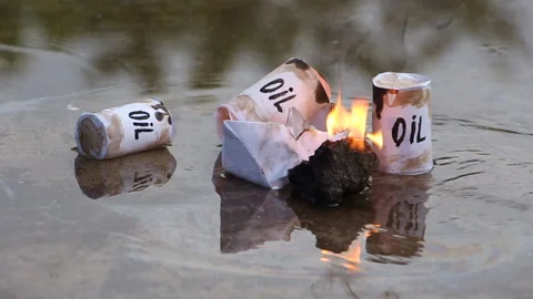 A paper ship with oil barrels explodes from their leakage Stock Footage 109094211