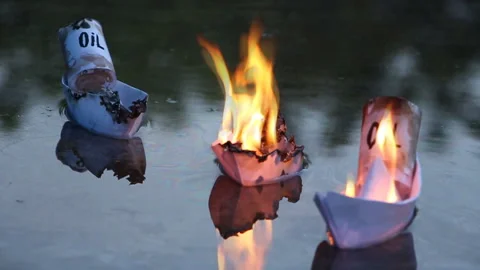 A paper ship with oil barrels explodes from their leakage Stock Footage 109100845