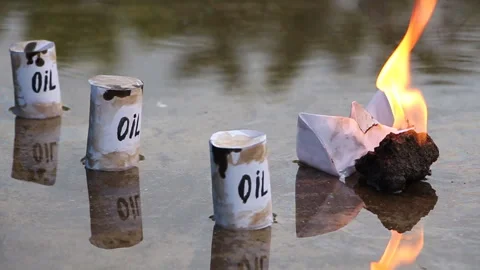 A paper ship with oil barrels explodes from their leakage Stock Footage 109123750