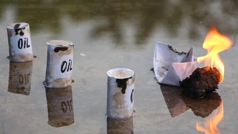 A paper ship with oil barrels explodes from their leakage Stock Footage 109126831