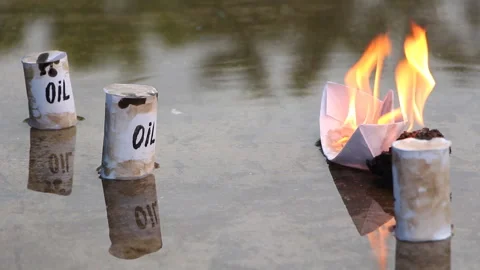 A paper ship with oil barrels explodes from their leakage Stock Footage 110726446