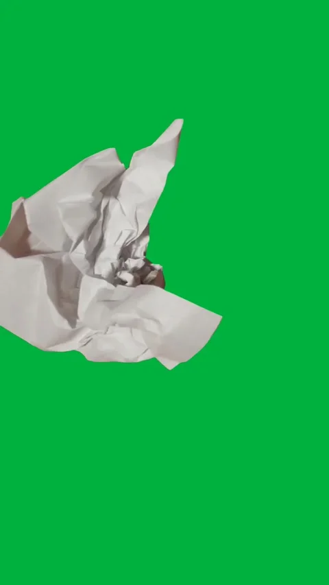 Paper shown with a smooth tear creating a controlled effect on green. Stock Footage 306846867