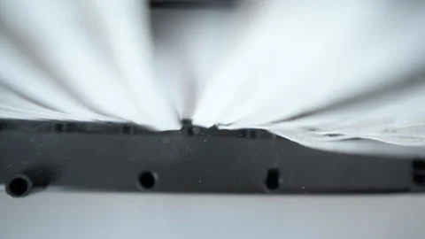 Paper shredder in action, destroying a document into fine strips. Stock Footage 304366338
