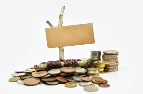 Paper sign board with stack of coins Stockfoto's