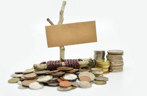 Paper sign board with stack of coins Stockfoto's