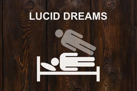 Paper sleeping man on bed with text LUCID DREAMS Stock Illustration