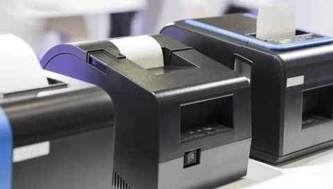 Paper slip exit from thermal printer Stock Photos