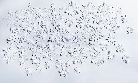 Paper snowflakes on white background Stock Photos