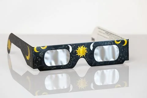 Paper solar eclipse glasses protecting eyes viewing sun Stock Photos