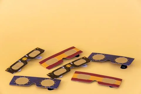Paper solar eclipse viewing glasses protecting eyes Stock Photos
