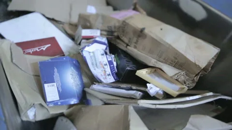 Paper on the sorting conveyor. Waste sorting. Recycling waste. Stock Footage 125646972