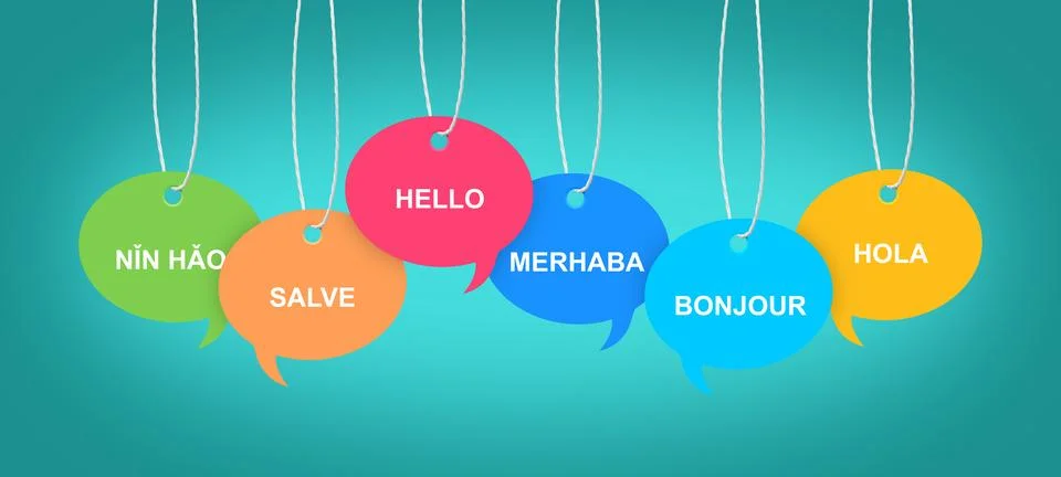 Paper speech bubbles with greetings in different languages hanging on dark .. Stock Photos